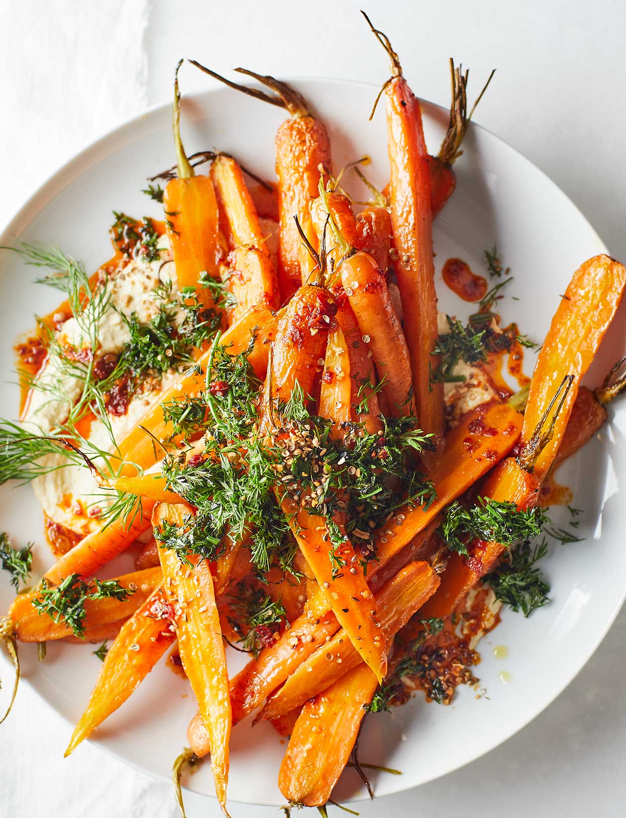 Roast carrot and houmous salad with harissa recipe | Sainsbury`s Magazine