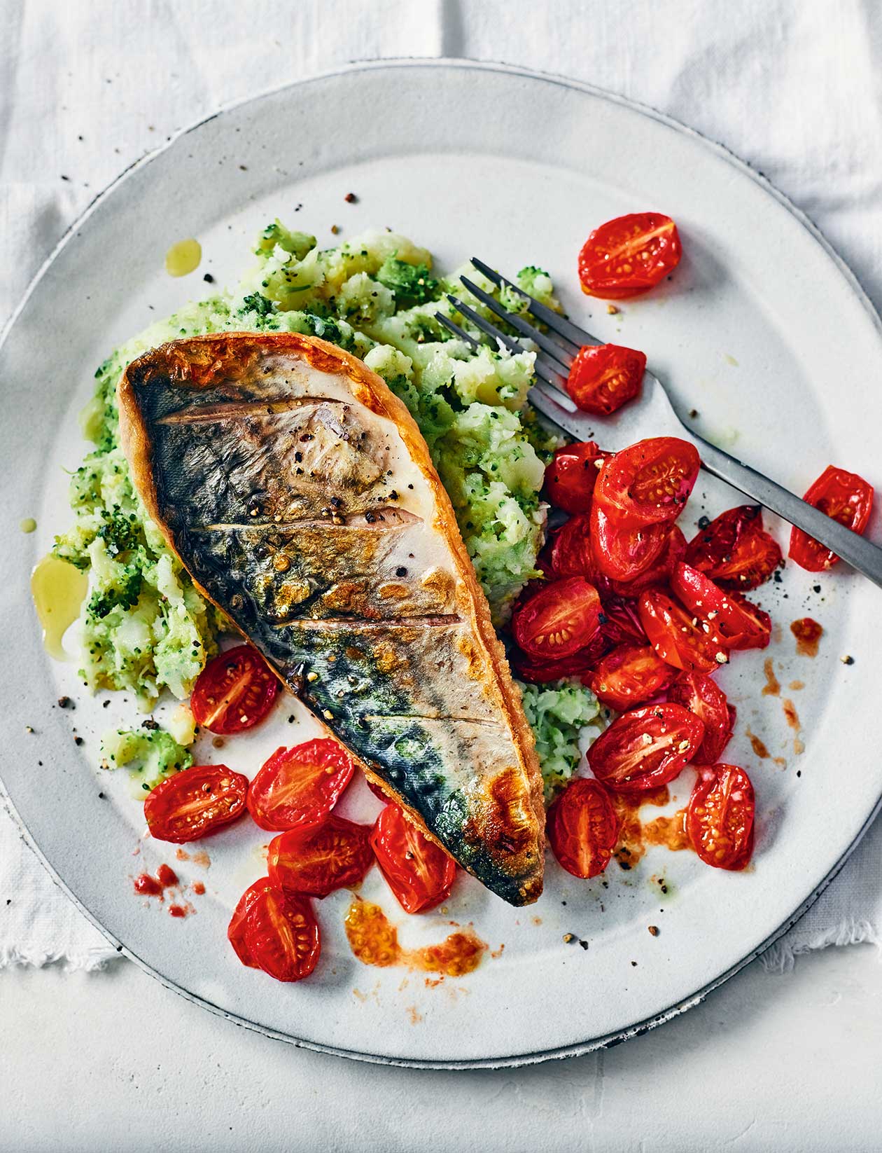 Mackerel and tomatoes with broccoli smash recipe | Sainsbury`s Magazine