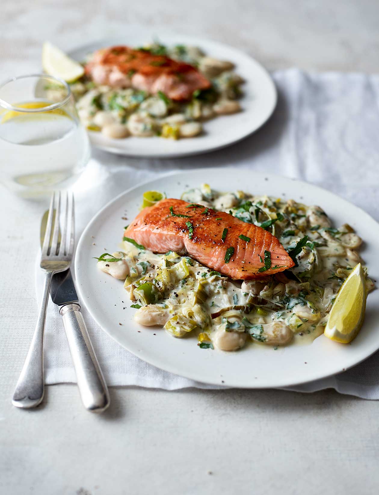 salmon-with-creamy-leeks-and-butter-beans-recipe-sainsbury-s-magazine