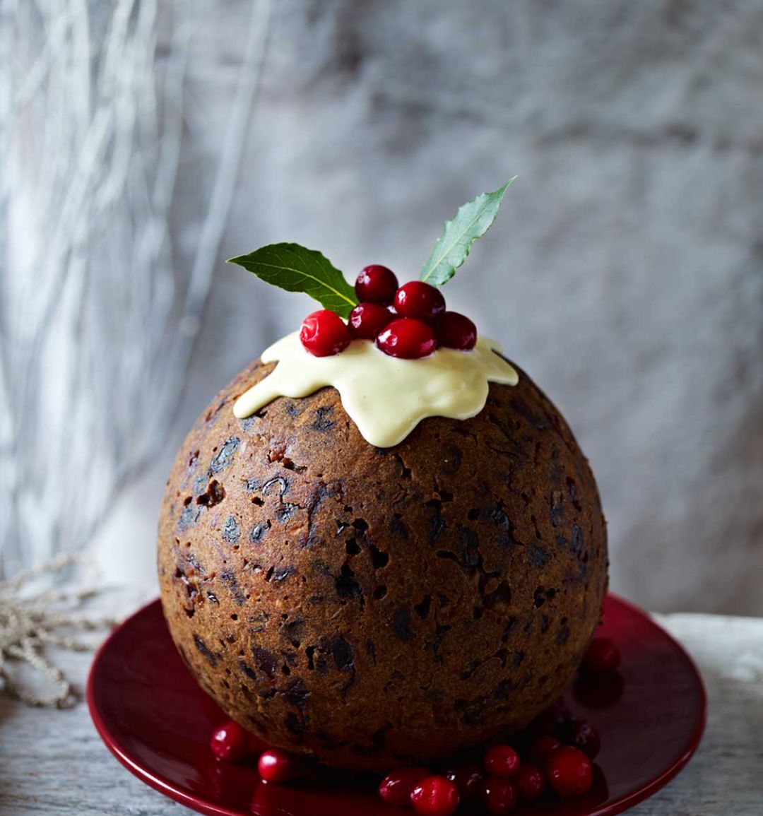 Cranberry gingerbread Christmas pudding with ginger sauce