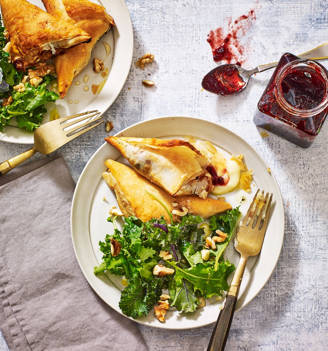 Cheese and cranberry parcels with baby kale salad