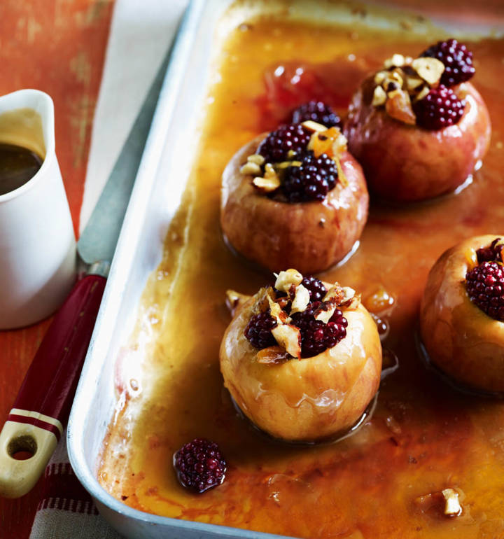 Baked toffee apples with blackberries